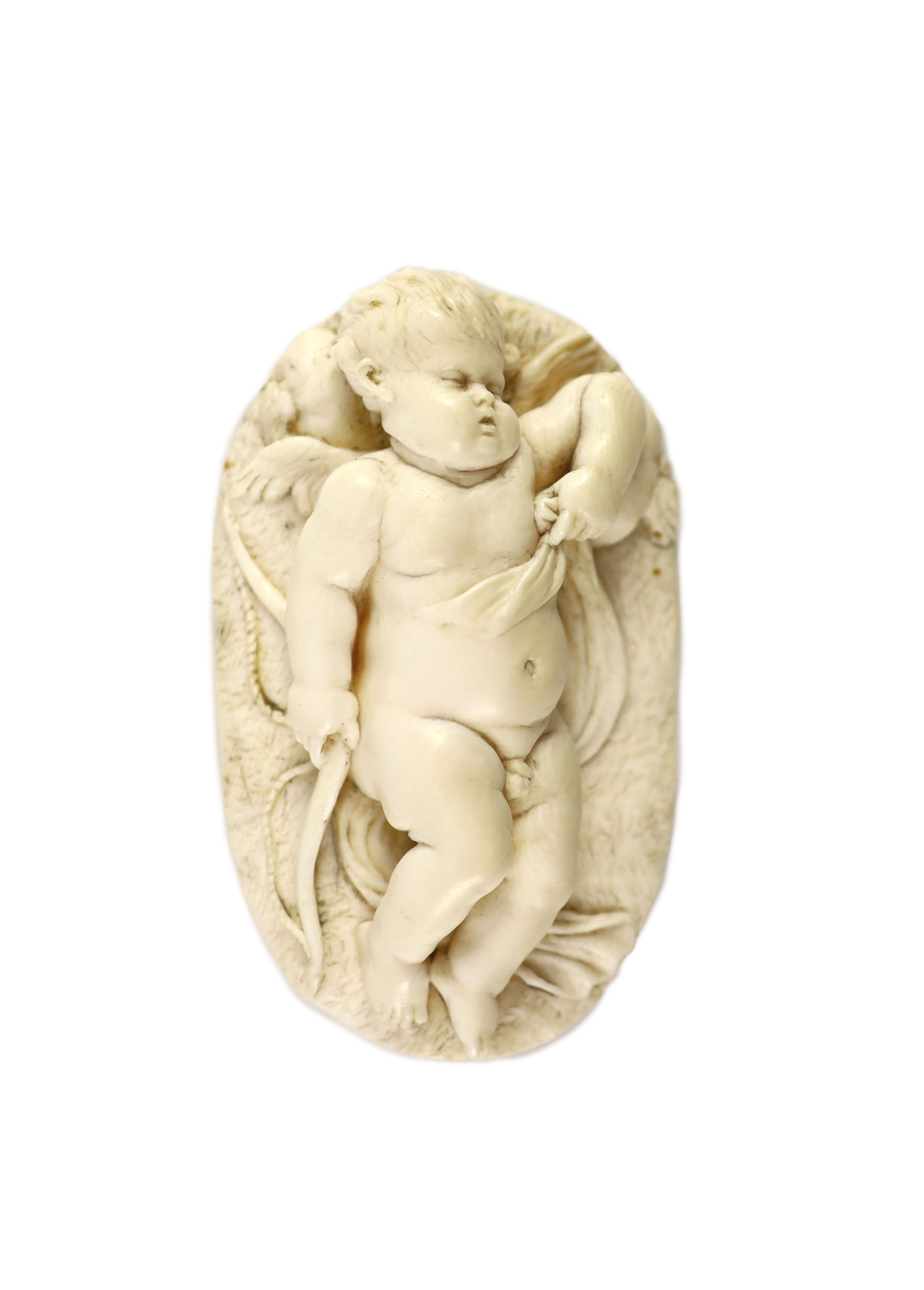 After Francois du Quesnoy (1594-1643). An oval ivory relief of sleeping Cupid, possibly Netherlandish 17th/18th century, 11 x 6.5cm height 2.5cm
